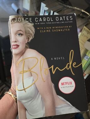 Blonde by Joyce Carol-Oates. Novel based on life of Marilyn Monroe.